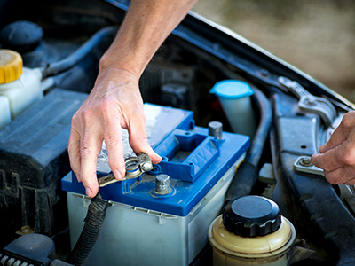 Placing the negative terminal on a battery