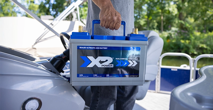 Person carrying an X2Power AGM boat battery