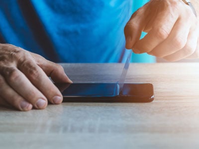 Placing a screen protector on a phone