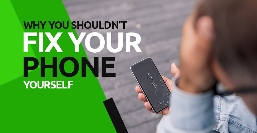 Man looking stressed at a phone with a broken screen